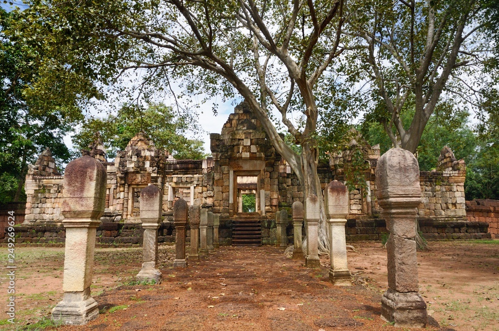 Laterite stone paved walkway with stone posts to the gates of 11th-century ancient Khmer temple Prasat Sdok Kok Thom in Sa Kaeo province of Thailand Laterite stone paved walkway with stone posts to the gates of 11th-century ancient Khmer temple Prasat Sdok Kok Thom in Sa Kaeo province of Thailand
