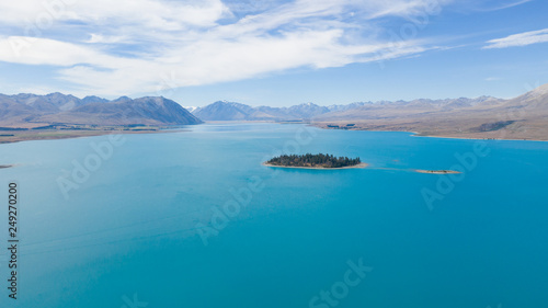 Lake tekapo from the air, aerial shot of the beautiful lake tekapro in New Zealand, stunning blue water lake in New Zealand, aerial photography of amazing nature, nature photography with a drone,