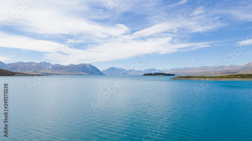 Lake tekapo from the air, aerial shot of the beautiful lake tekapro in New Zealand, stunning blue water lake in New Zealand, aerial photography of amazing nature, nature photography with a drone,