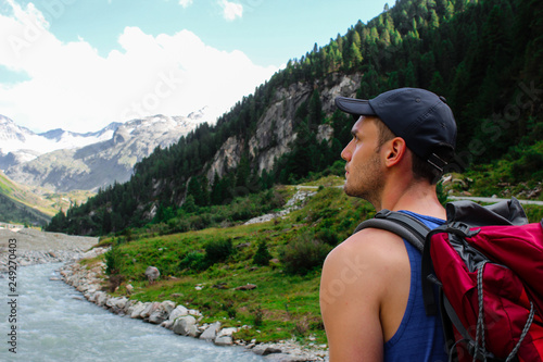 Man in front of a river in austria, in the Hohe Tauern national park photo