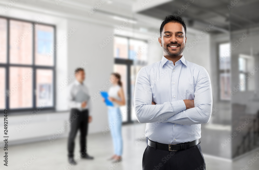 business, realty and people concept - smiling indian businessman or realtor over empty office room background business, realty and people concept - smiling indian businessman or realtor over empty office room background