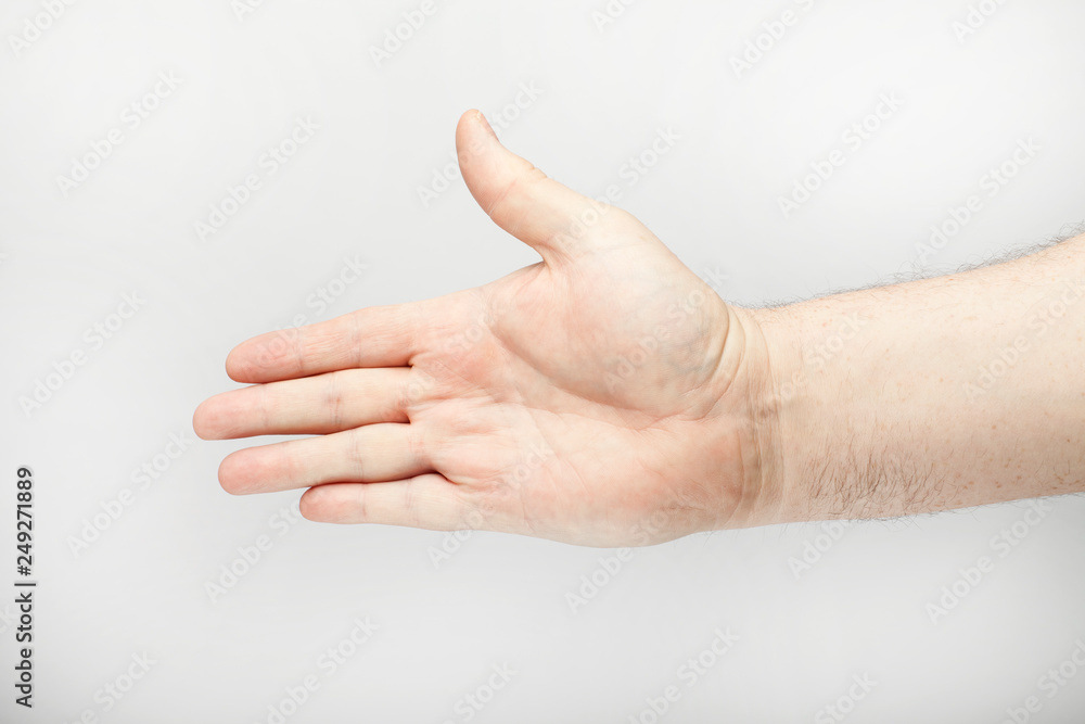 Male hand in the greeting pose Male hand in the greeting pose