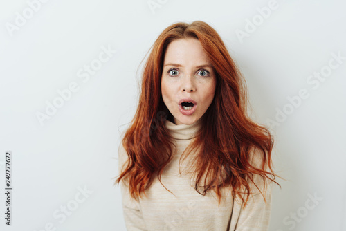 Shocked young woman with her mouth agape