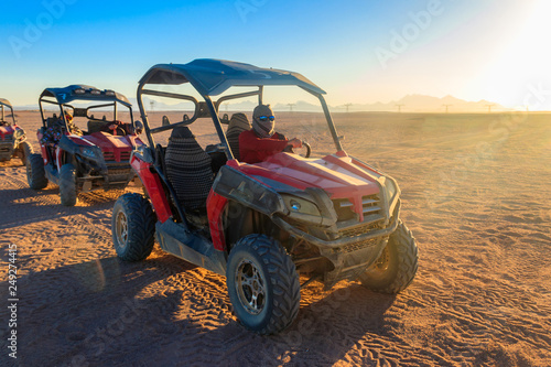 Safari trip through egyptian desert driving buggy cars photo
