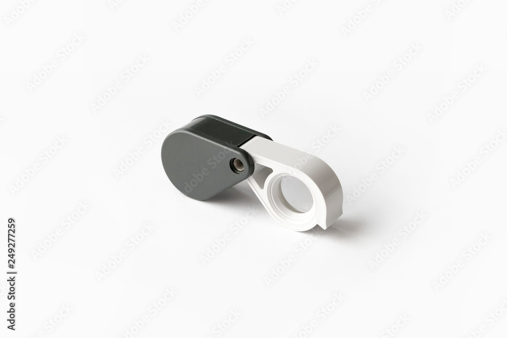 Magnifying glass for diamonds or see the amulet Isolated on a White Background. Magnifying glass for diamonds or see the amulet Isolated on a White Background.