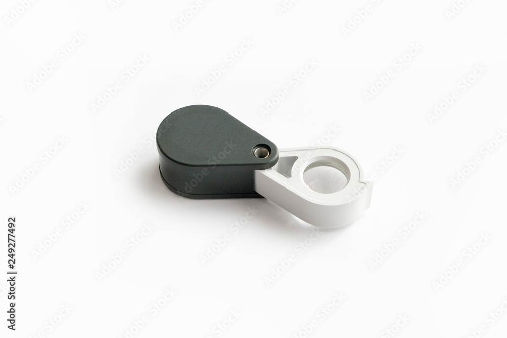 Magnifying glass for diamonds or see the amulet Isolated on a White Background. Magnifying glass for diamonds or see the amulet Isolated on a White Background.