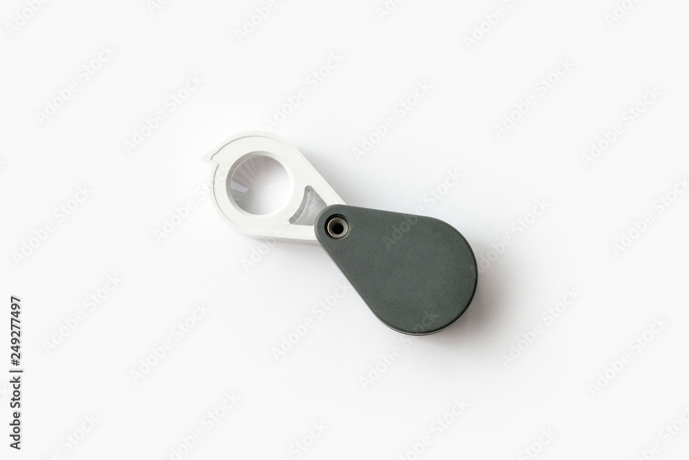 Magnifying glass for diamonds or see the amulet Isolated on a White Background. Magnifying glass for diamonds or see the amulet Isolated on a White Background.
