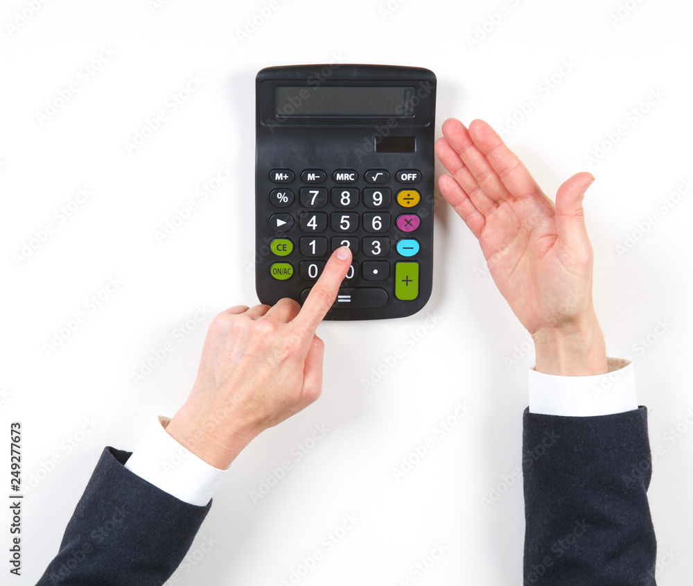 Hands businesswoman and black calculator Hands businesswoman and black calculator