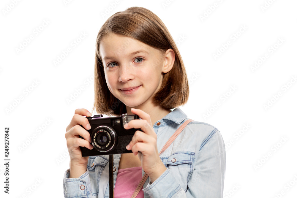 Smiling cute teen girl with a camera, close-up, isolated on white background Smiling cute teen girl with a camera, close-up, isolated on white background
