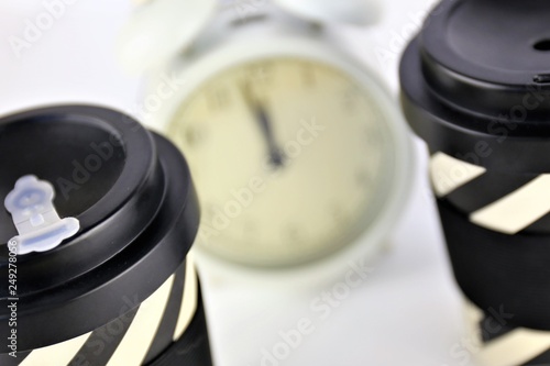 An Image of a coffee and a clock