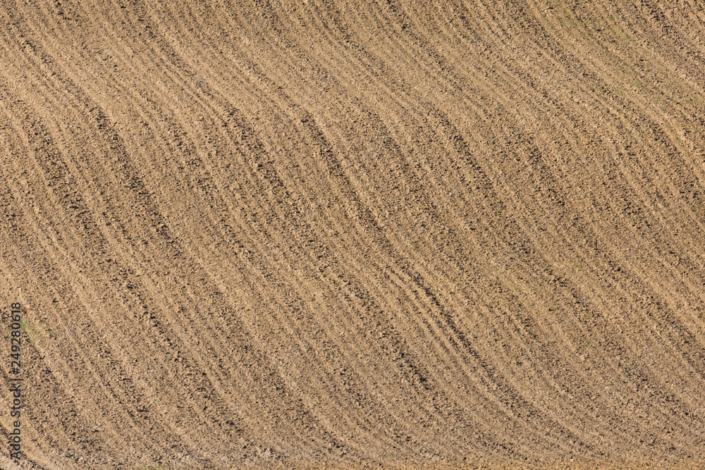 newly furrowed farmland with symmetrical furrows newly furrowed farmland with symmetrical furrows