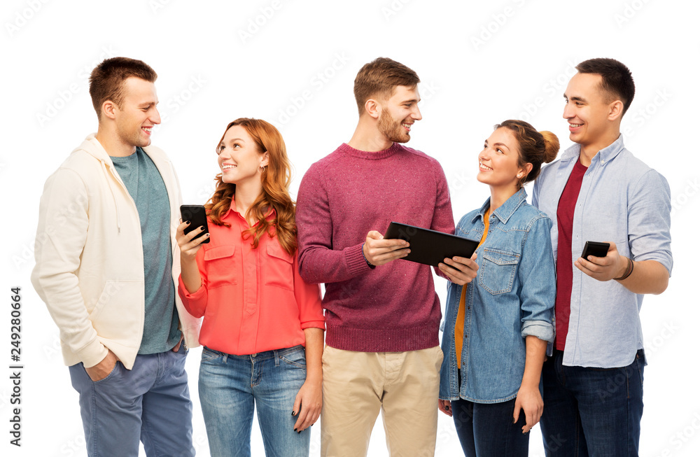 friendship and people concept - group of smiling friends with smartphones and tablet computer over white background