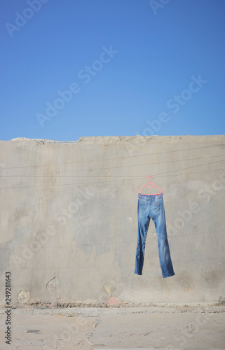 Blue Jeans hanging on Pink Washing Line