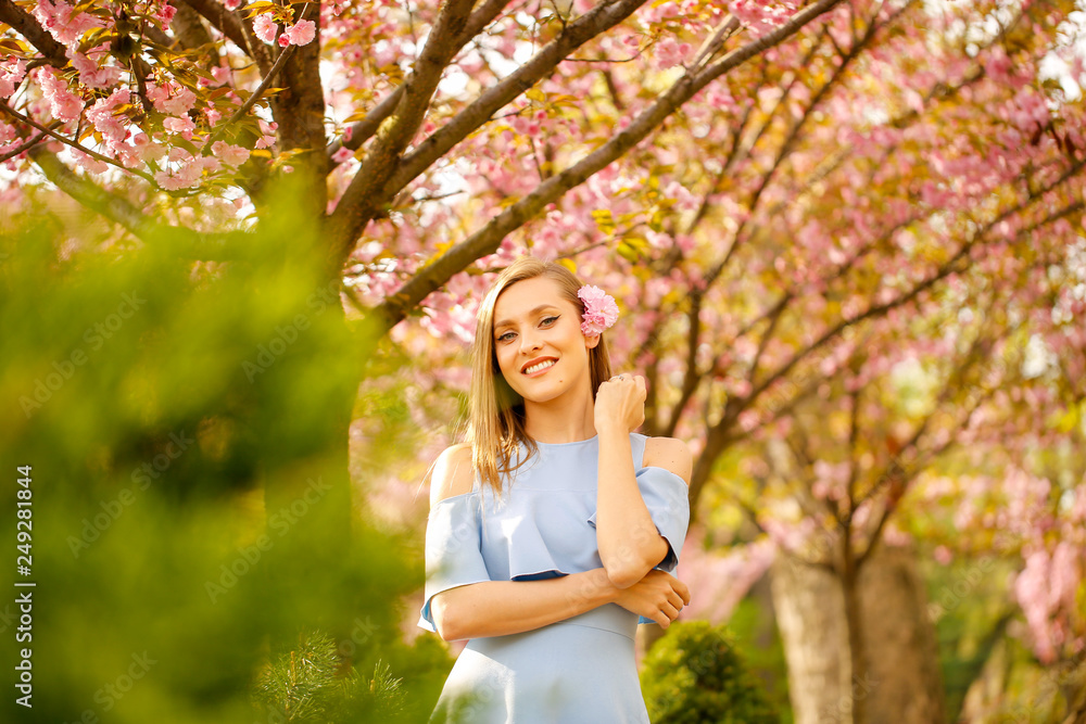 Beautiful blonde girl posing outdoor in park Beautiful blonde girl posing outdoor in park