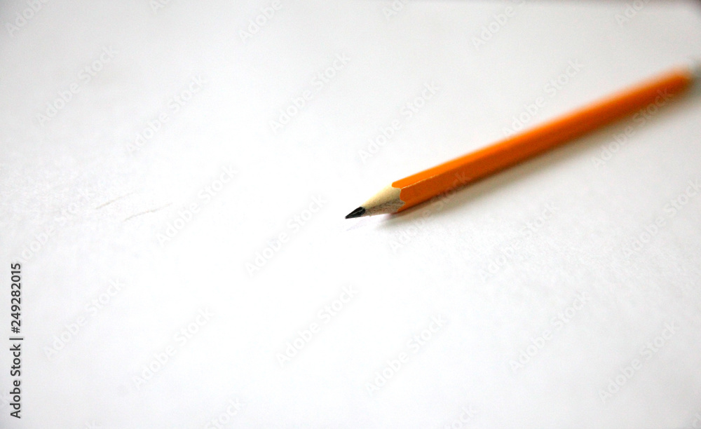 Yellow pencil on a white background Yellow pencil on a white background