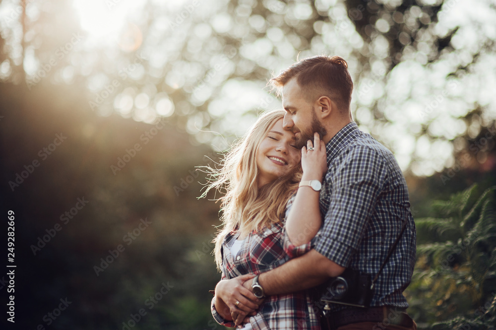 Fototapeta premium Hipster couple in love having fun together posing in mountain.