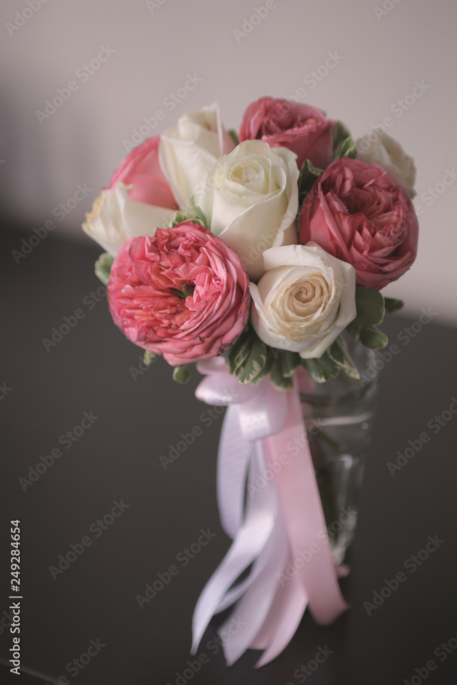 bouquet of white and red roses with pink ribbons in a glass vase bouquet of white and red roses with pink ribbons in a glass vase