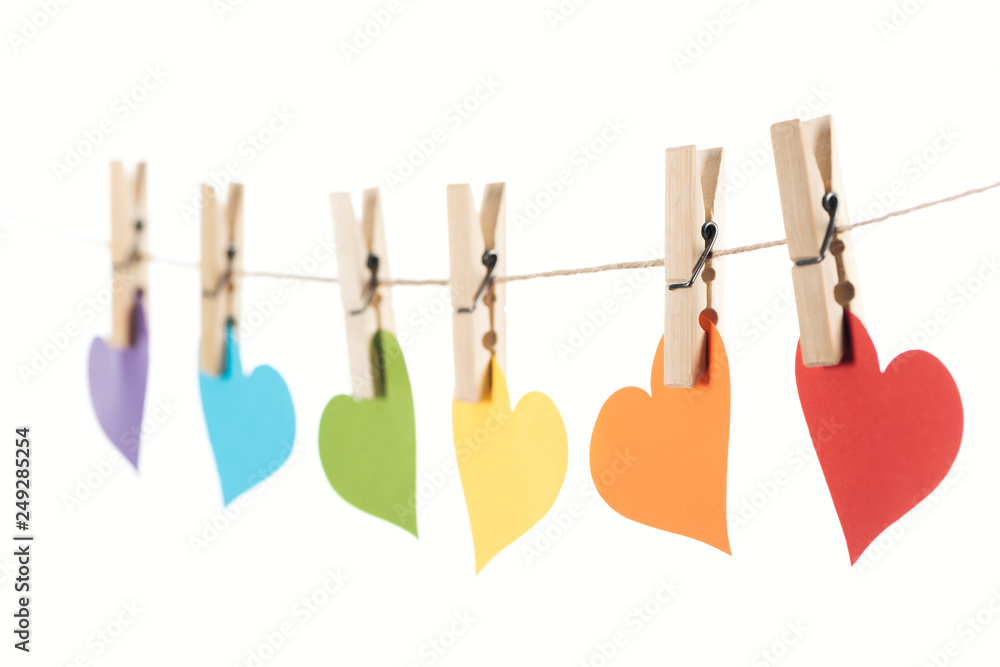 selective focus of rainbow multicolored paper hearts on rope isolated on white, lgbt concept selective focus of rainbow multicolored paper hearts on rope isolated on white, lgbt concept