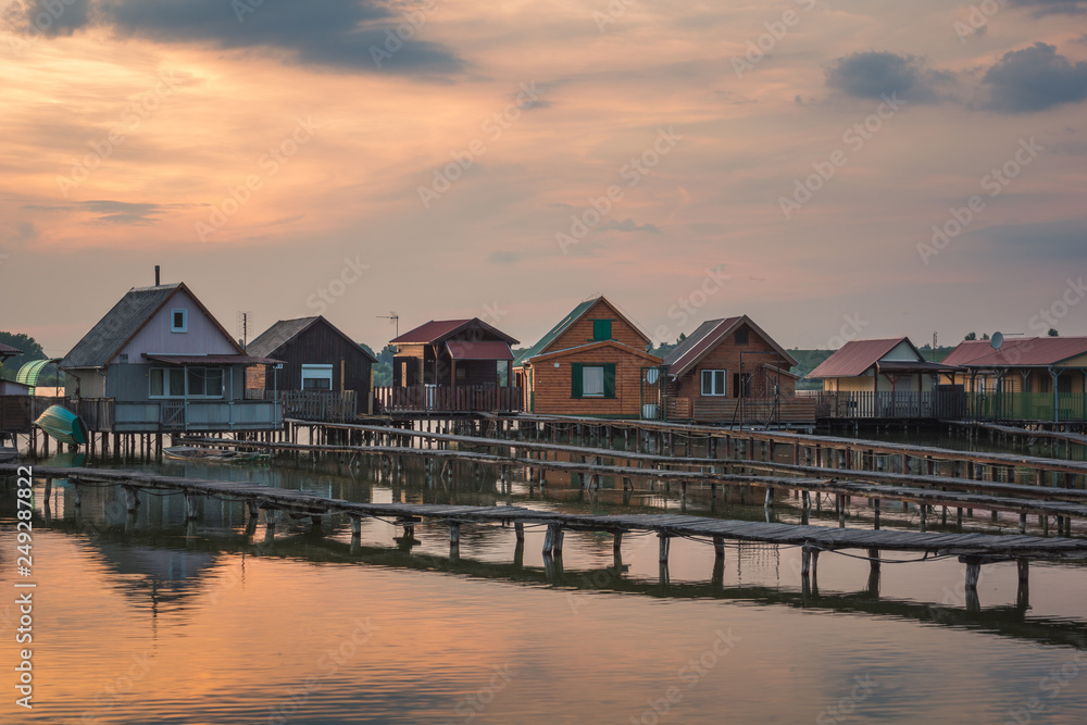 Wooden cottages on the Bokod lake in Hungary