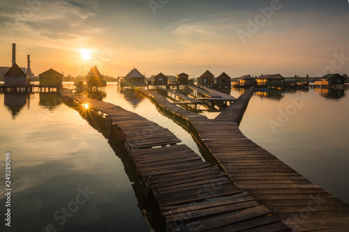 Wooden cottages on the Bokod lake in Hungary photo