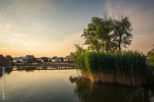 Wooden cottages on the Bokod lake in Hungary