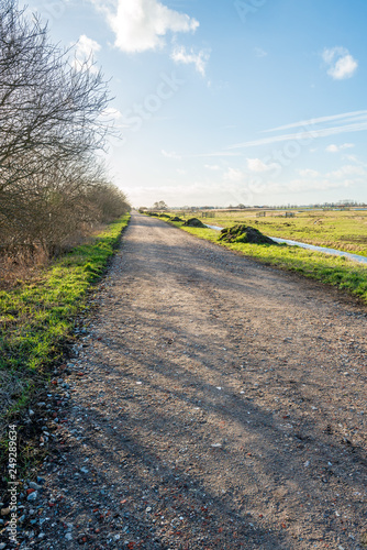 Country road covered with rubble in a Dutch polder