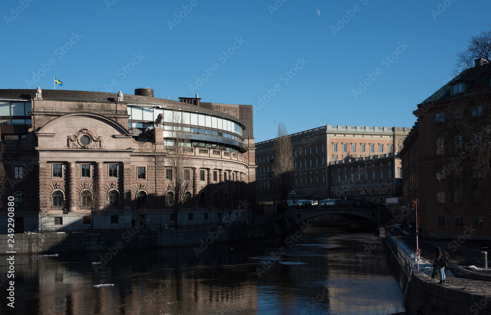 An early sunny spring day, meltwater under bridges at the government centre and castle in Stockholm
