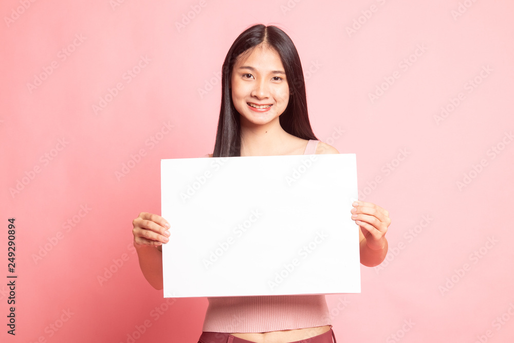 Young Asian woman with white blank sign. Young Asian woman with white blank sign.