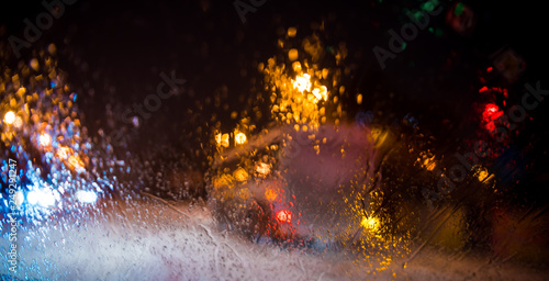 Raindrops on a car window with beautifully blurred background
