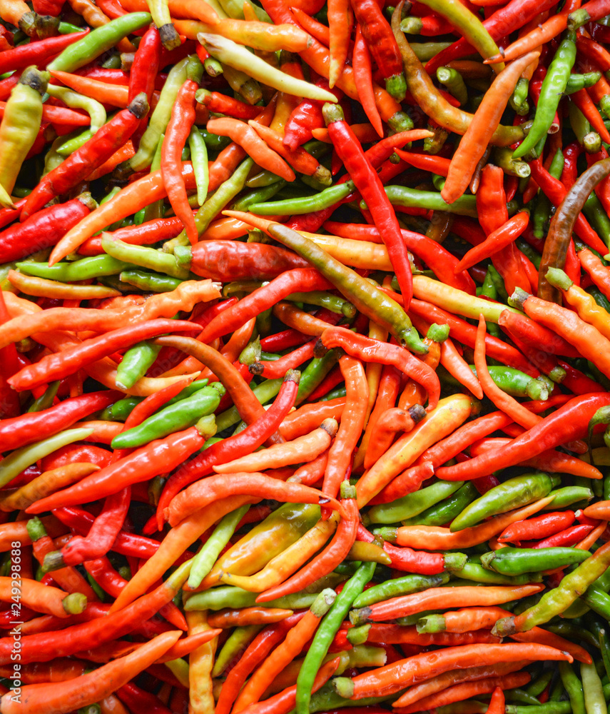 Chili background / Fresh red and green chilli pepper texture Chili background / Fresh red and green chilli pepper texture