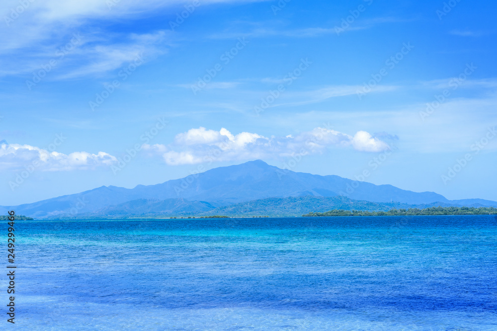 Beautiful ocean scene view isolated with light blue sky background, concept of vacation and sea travel, copy space Beautiful ocean scene view isolated with light blue sky background, concept of vacation and sea travel, copy space