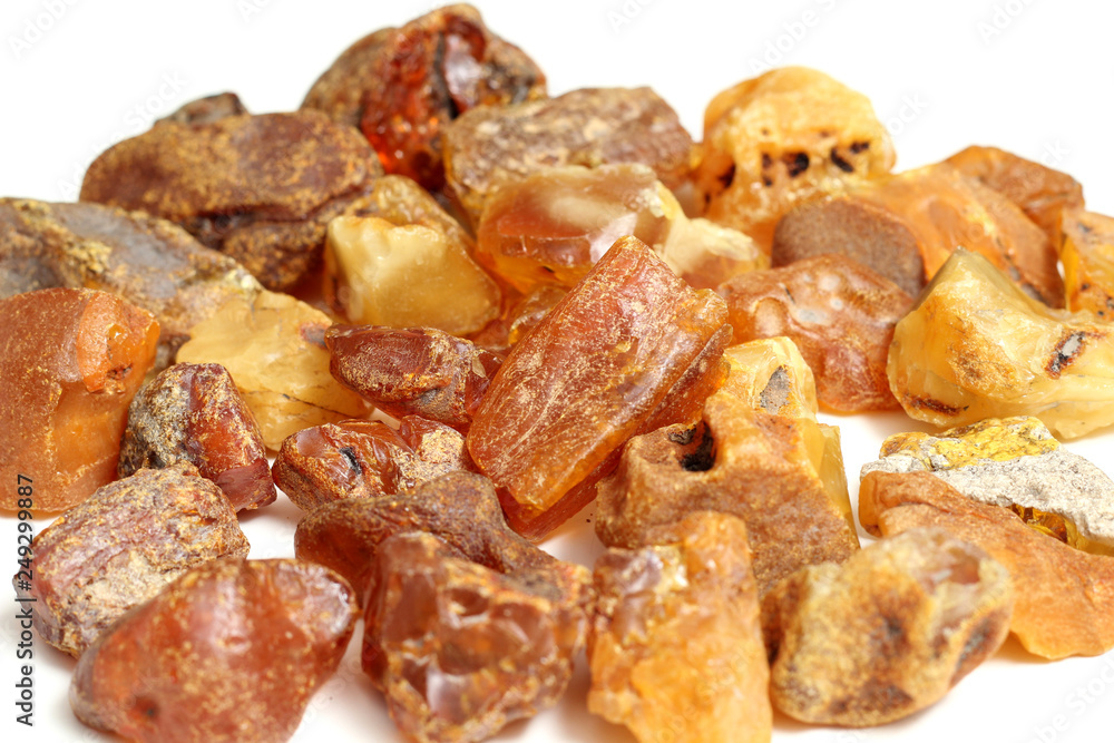 Natural raw amber stone isolated on white background. Multiple amber gemstone in various shapes and colour. Jewelry components. Natural raw amber stone isolated on white background. Multiple amber gemstone in various shapes and colour. Jewelry components.