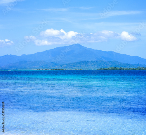 Beautiful ocean scene view isolated with light blue sky background, concept of vacation and sea travel, copy space © RomixImage