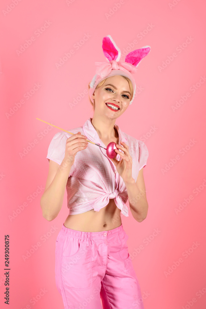 Happy easter! Painting egg. Easter Day. White rabbit. Bunny costume. Smiling woman with bunny ears painting egg. Easter day concept. Isolated. Eggs for Easter. Season sales. Advertising. Spring sale.