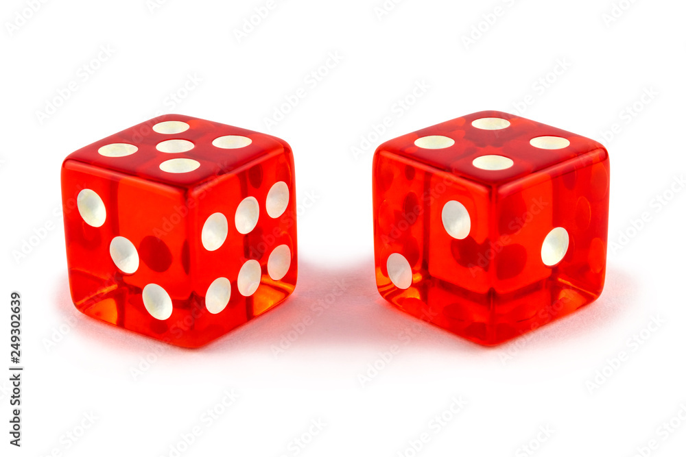 Two red glass game dice very close up isolated on white background. Five and four with a shadow. Two red glass game dice very close up isolated on white background. Five and four with a shadow.