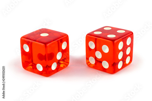 Two red glass game dice very close up isolated on white background. One and four with a shadow.