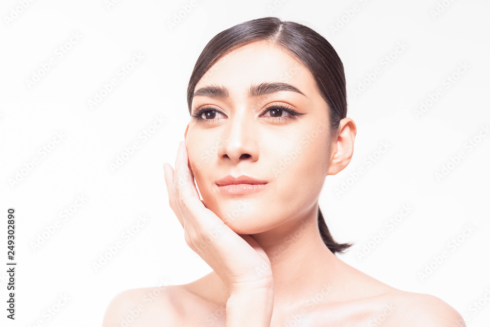 Beautiful young Asian woman with clear fresh skin touch her own face . Facial treatment, skin cleanser, cosmetology, beauty and spa conceptual. Beautiful young Asian woman with clear fresh skin touch her own face . Facial treatment, skin cleanser, cosmetology, beauty and spa conceptual.