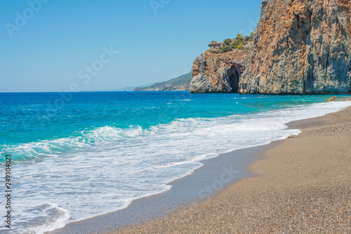 Beautiful seascape with sea wash and a rock (Turkey, Gazipasha, Mediterranean sea).