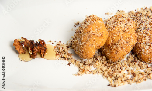 Traditional greek honey cookies with nuts called melomakarouna. photo