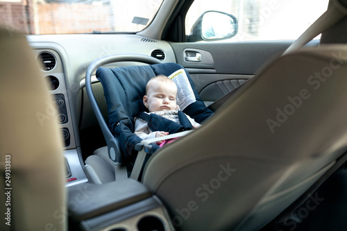 Baby taking a nap with baby car seat providing the comfort © didesign