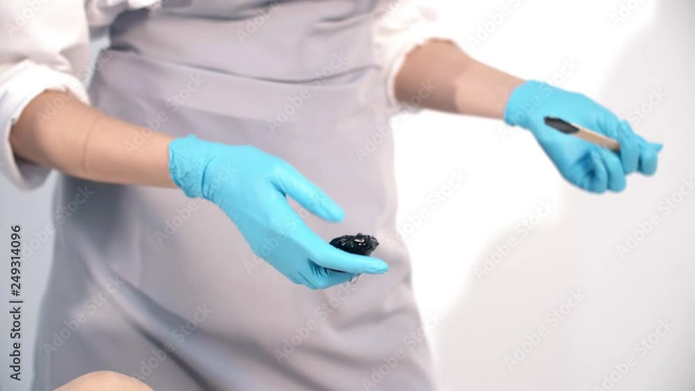 Sugar paste for sugaring in beauty salon. Beautician holds sugar paste with his hands. Sugar paste for sugaring in beauty salon. Beautician holds sugar paste with his hands.