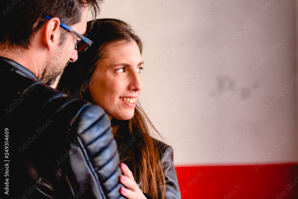 Loving couple loved embracing each other in a garden of a city hidden from prying eyes. Loving couple loved embracing each other in a garden of a city hidden from prying eyes.