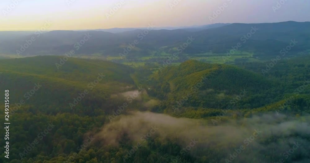 mountains in a fog clouds