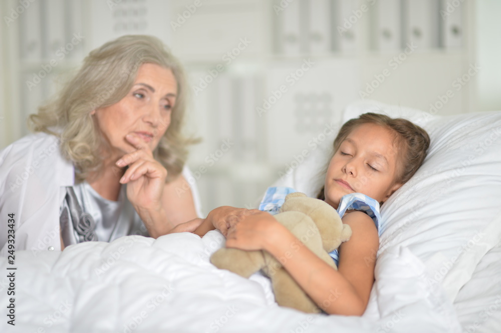 Portrait of sad senior woman with granddaughter Portrait of sad senior woman with granddaughter