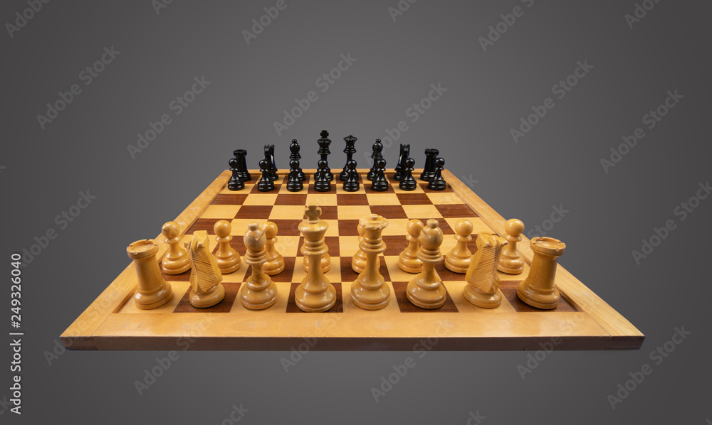 White and black chess pieces placed on a chessboard White and black chess pieces placed on a chessboard