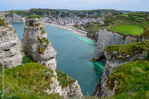 Scenic alabaster chalk cliffs of Etretat and coast of Atlantic ocean, travel and vacation destination in Normandy, France