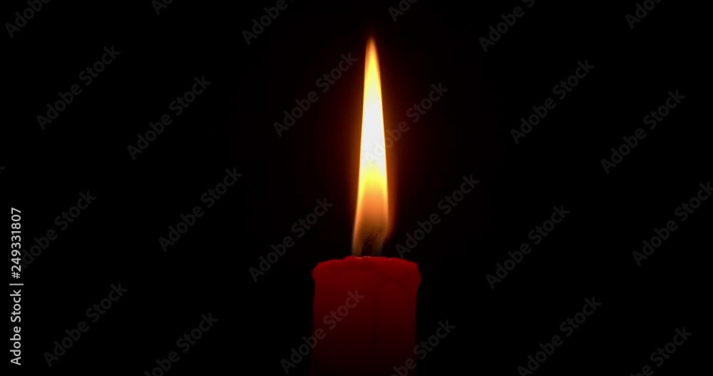 Burning red candle on a black background. Close-up, 4K. Burning red candle on a black background. Close-up, 4K.