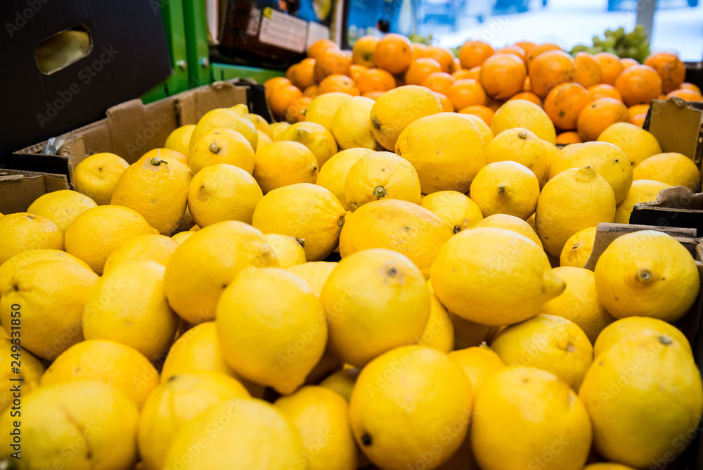 fresh citrus fruits are on the counter in the store