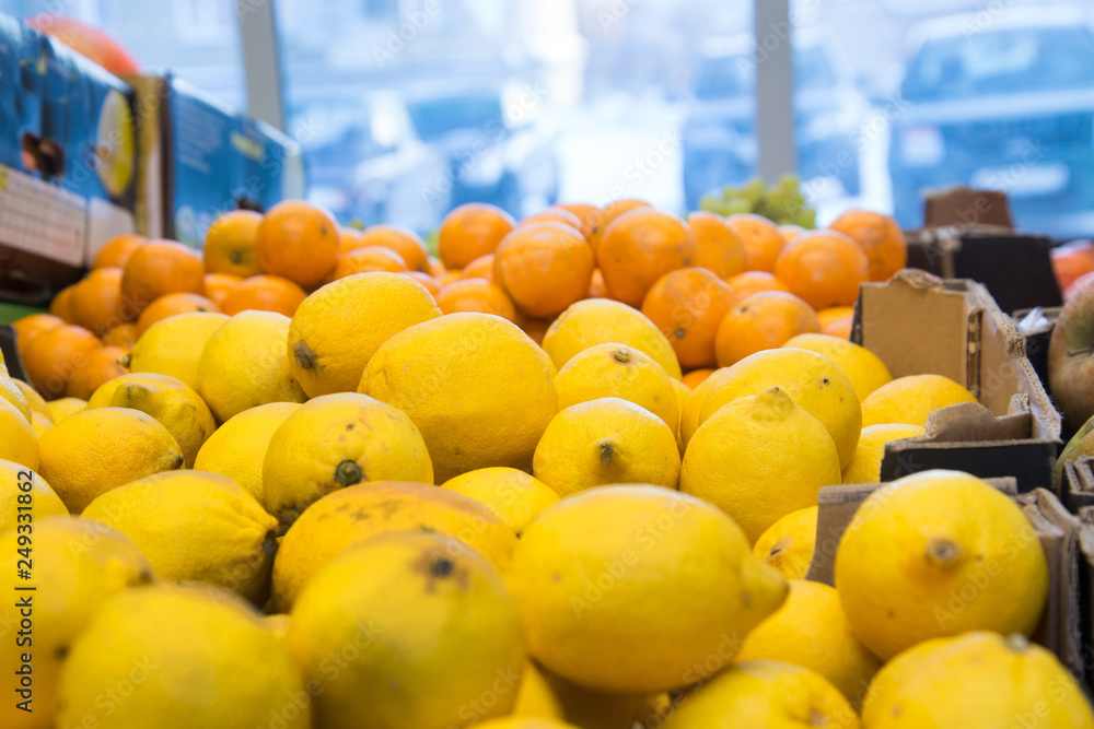 fresh citrus fruits are on the counter in the store