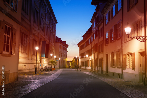 Street lights of Basel old city during sunset © Sergey Novikov